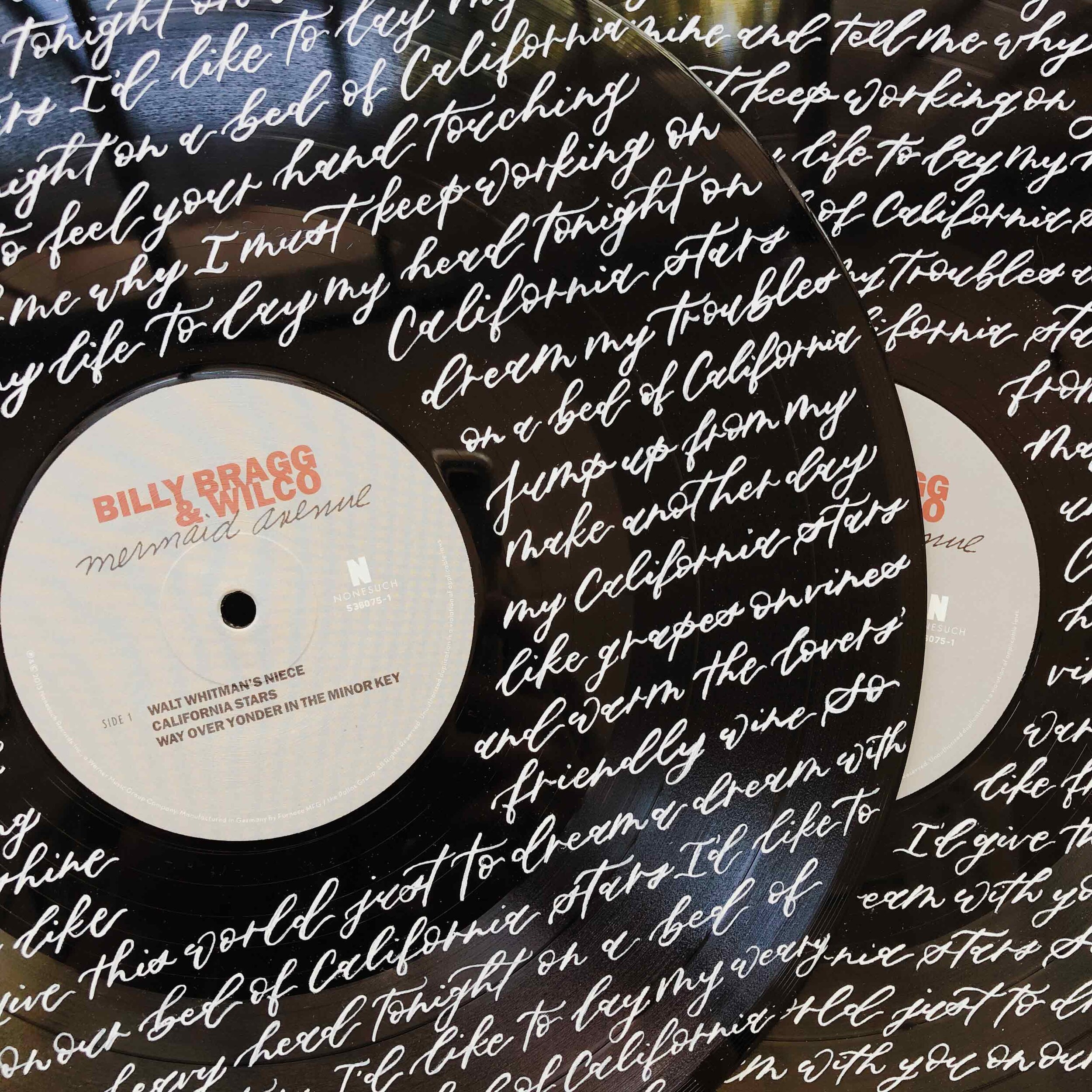 hand-painted calligraphy on vinyl records