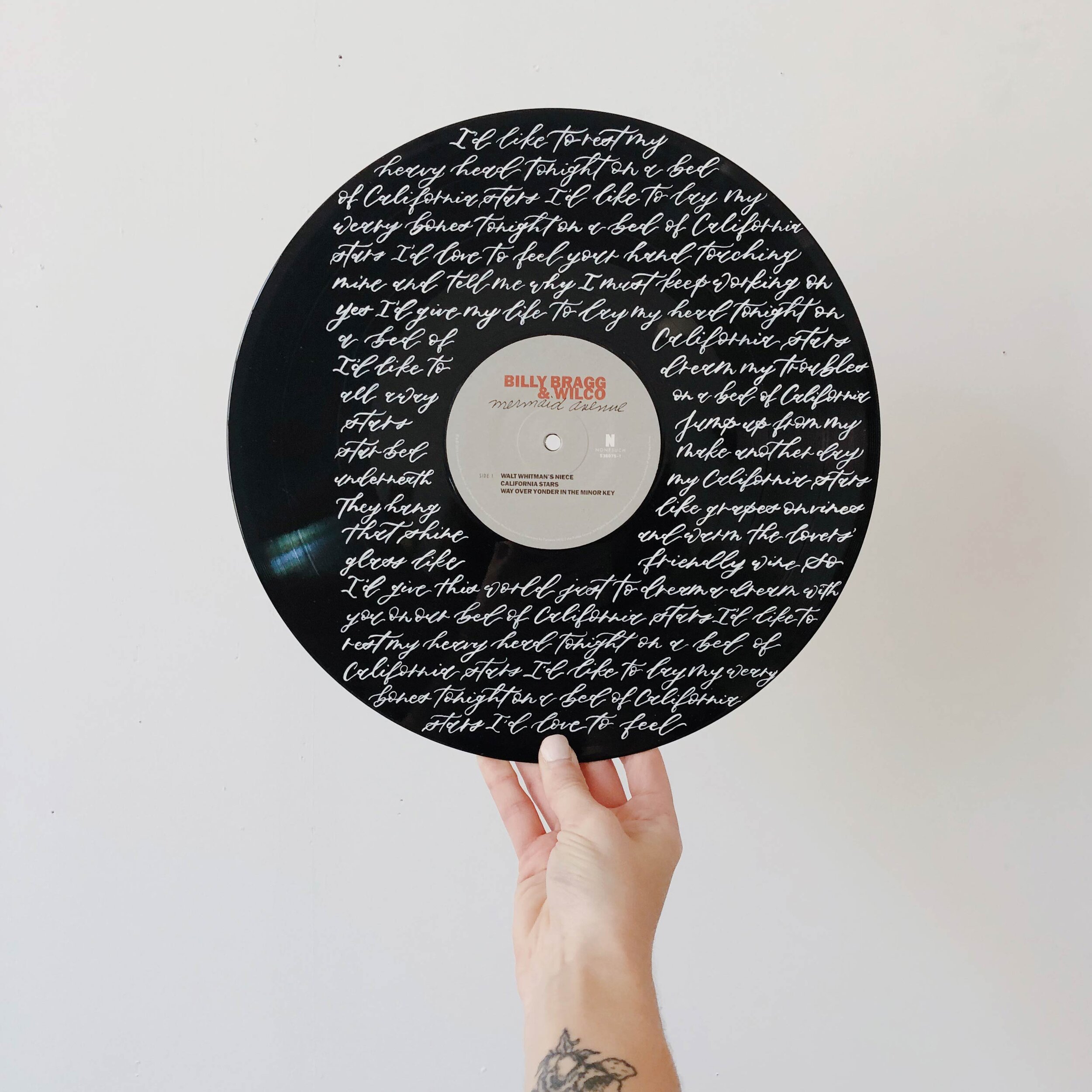 hand-painted calligraphy on vinyl record