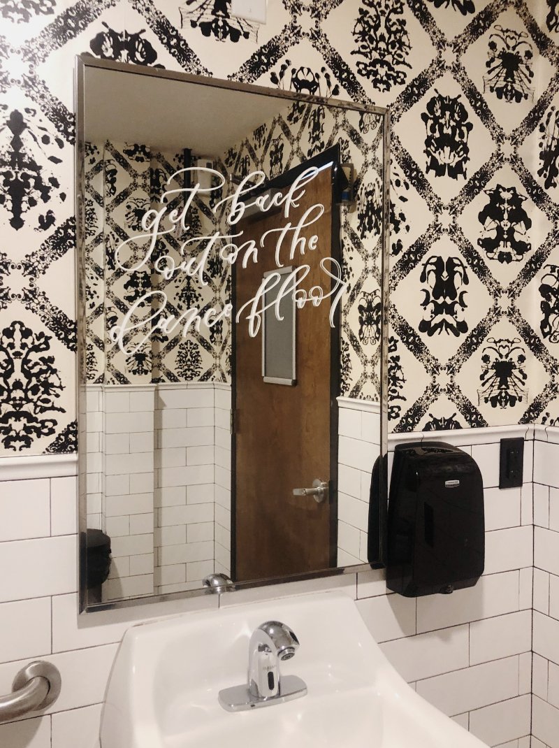 adding personal touches on your wedding day with bathroom mirror calligraphy