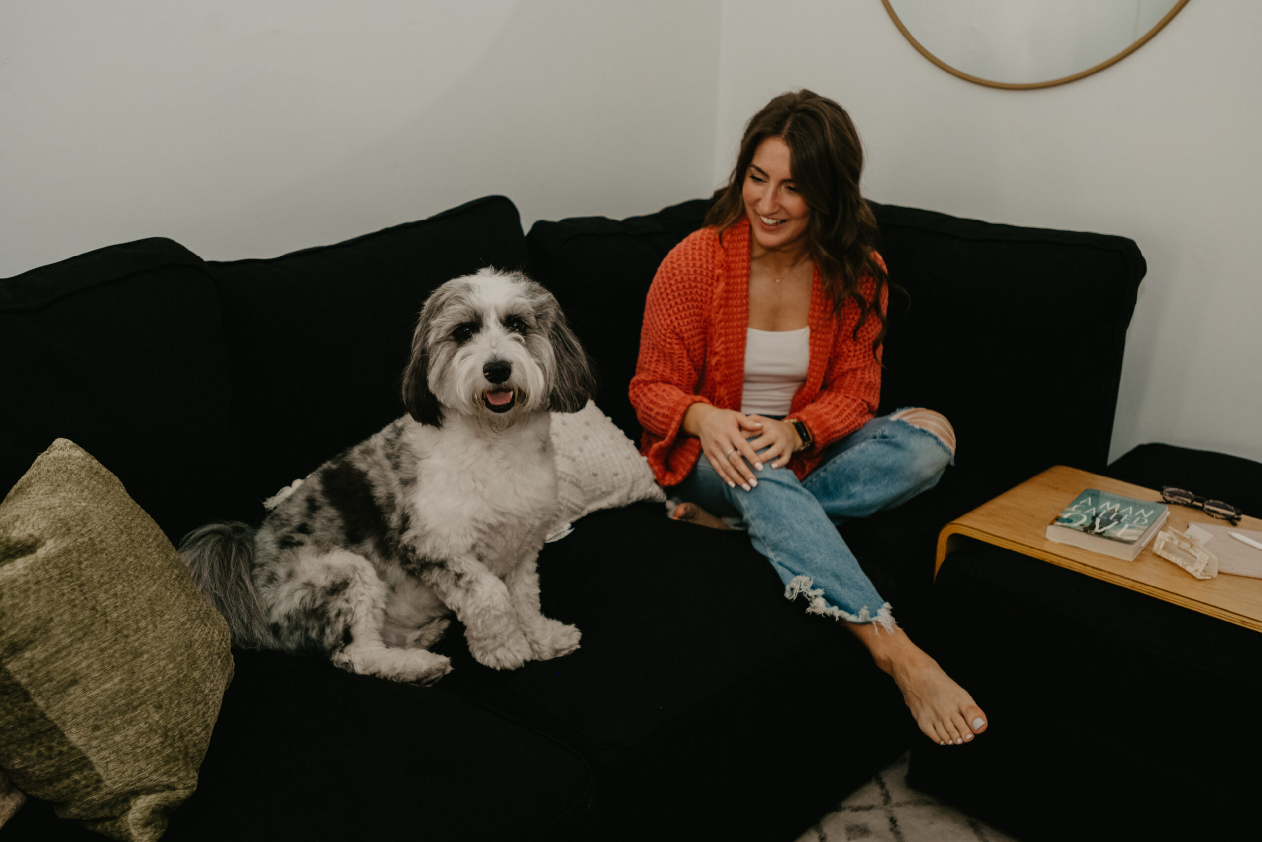 alane gianetti of write pretty for me on a couch with her dog