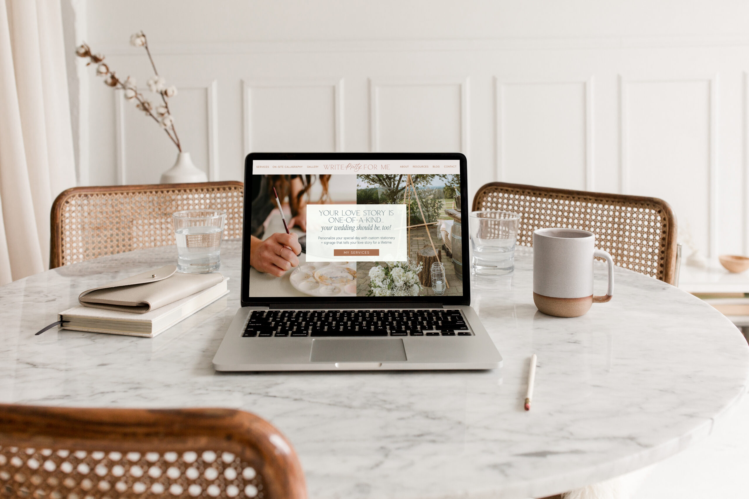 a lap top on a marble table - calligraphy business from scratch