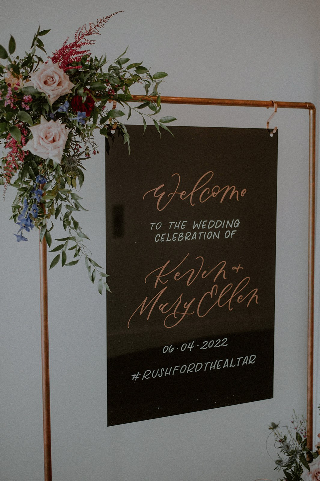 wedding welcome sign with floral accents