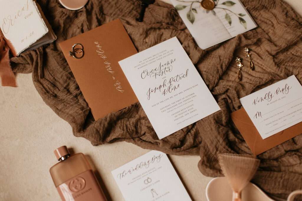 Flat lay of wedding invitation suite showing design ideas for what to offer during slow season.